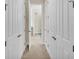 Hallway with a view of the bathroom and several closed doors at 1342 Heritage Landings Dr, Lakeland, FL 33805