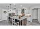 Bright, updated kitchen with white cabinets, a center island with seating, and stainless steel appliances at 1342 Heritage Landings Dr, Lakeland, FL 33805