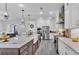 Open concept kitchen with a large center island, stainless steel appliances, and a seamless flow to the living areas at 1342 Heritage Landings Dr, Lakeland, FL 33805