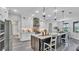Modern kitchen with white cabinetry, stainless steel appliances, and a spacious center island at 1342 Heritage Landings Dr, Lakeland, FL 33805