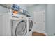 Laundry room featuring front load washer and dryer and shelving at 1342 Heritage Landings Dr, Lakeland, FL 33805