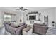 Comfortable living room features a decorative built-in entertainment center and sliding glass doors at 1342 Heritage Landings Dr, Lakeland, FL 33805
