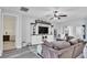 Spacious living room with built-in entertainment center and ceiling fan at 1342 Heritage Landings Dr, Lakeland, FL 33805