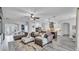 Open-concept living room with stylish decor and an adjacent modern kitchen at 1342 Heritage Landings Dr, Lakeland, FL 33805