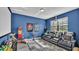 Cozy media room with tiered seating, projector, and themed decor at 1342 Heritage Landings Dr, Lakeland, FL 33805