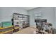 Office space with shelving and a desk with monitors at 1342 Heritage Landings Dr, Lakeland, FL 33805