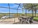 Al Fresco dining on this screened patio with great lake view at 1342 Heritage Landings Dr, Lakeland, FL 33805