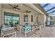 Covered patio provides ample seating with a view of the lake at 1342 Heritage Landings Dr, Lakeland, FL 33805
