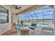 Relaxing screened patio offers comfortable seating and scenic lake views at 1342 Heritage Landings Dr, Lakeland, FL 33805