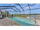 Bask in this inviting screened pool and enjoy serene lake views at 1342 Heritage Landings Dr, Lakeland, FL 33805