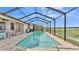 Relax and unwind in this refreshing screened pool with beautiful lake views at 1342 Heritage Landings Dr, Lakeland, FL 33805