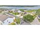 Street view of waterfront neighborhood featuring well manicured lawns, solar panels, and boat docks at 1342 Heritage Landings Dr, Lakeland, FL 33805