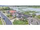 A street view of luxury homes with well manicured lawns and water views at 1342 Heritage Landings Dr, Lakeland, FL 33805