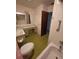 Vintage bathroom featuring tub, toilet, sink with vanity, and medicine cabinet at 1528 Hallam S Ct, Lakeland, FL 33813