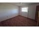 Bedroom featuring carpet and natural light at 1528 Hallam S Ct, Lakeland, FL 33813