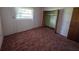 Bedroom featuring carpet flooring and standard closet at 1528 Hallam S Ct, Lakeland, FL 33813