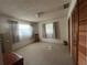 Bedroom with carpet, natural light, and wooden closet at 1528 Hallam S Ct, Lakeland, FL 33813