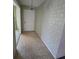 Foyer area showcasing patterned wallpaper and tile flooring at 1528 Hallam S Ct, Lakeland, FL 33813