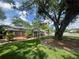 Charming brick home with well-manicured front yard and mature trees at 1528 Hallam S Ct, Lakeland, FL 33813