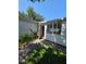 Charming patio and a sunroom accessible via a walkway at 1528 Hallam S Ct, Lakeland, FL 33813