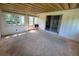 Cozy sun room with beamed ceiling, multiple windows, and sliding glass door with a view at 1528 Hallam S Ct, Lakeland, FL 33813