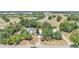 Aerial view of a home surrounded by mature trees and greenery, offering a serene and private setting at 1650 W Mcleod St, Bartow, FL 33830
