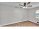 Bright bedroom with wood floors, ceiling fan and neutral paint at 1650 W Mcleod St, Bartow, FL 33830