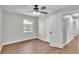 Bedroom featuring a ceiling fan, closet and view to the hallway at 1650 W Mcleod St, Bartow, FL 33830