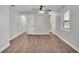 Bedroom with wood flooring, ceiling fan and updated lighting at 1650 W Mcleod St, Bartow, FL 33830