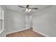 Bedroom with ceiling fan, wood-look flooring, and bright, neutral paint at 1650 W Mcleod St, Bartow, FL 33830