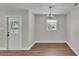 The dining area features a modern light fixture and neutral decor at 1650 W Mcleod St, Bartow, FL 33830