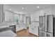 Newly renovated kitchen features stainless steel appliances and white cabinetry at 1650 W Mcleod St, Bartow, FL 33830