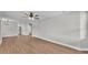 Open concept living area featuring light wood flooring and a ceiling fan at 1650 W Mcleod St, Bartow, FL 33830