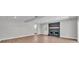 Spacious living area with a brick fireplace, hardwood floors, white trim, recessed lighting and ample natural light at 1650 W Mcleod St, Bartow, FL 33830