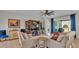 Comfortable living room with tile floors, neutral walls, stylish furniture, and sliding doors to the patio at 1983 Via Lago Dr, Lakeland, FL 33810