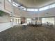 Large clubhouse with neutral decor, ceiling fans, open space, and an entertainment area with tables and chairs at 4139 Cobblestone Dr, Lakeland, FL 33813