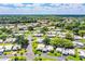 Scenic aerial view showcasing the community's prime location near a tranquil lake at 635 Cottage Ln # 635, Lakeland, FL 33803