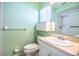 Well-lit bathroom featuring a vanity with storage, toilet, and walk-in shower at 635 Cottage Ln # 635, Lakeland, FL 33803