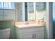 Bathroom features a vanity with sink, mirror, and ample storage at 635 Cottage Ln # 635, Lakeland, FL 33803