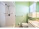 Tiled bathroom with shower, vanity, and built-in storage for all your essentials at 635 Cottage Ln # 635, Lakeland, FL 33803