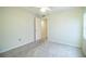 Bedroom featuring plush carpeting, a ceiling fan, and a spacious closet at 635 Cottage Ln # 635, Lakeland, FL 33803