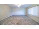 Expansive bedroom features carpeting, ceiling fan, and a bright window, offering a welcoming space at 635 Cottage Ln # 635, Lakeland, FL 33803