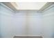 Empty walk-in closet with built-in shelving, providing ample storage space at 635 Cottage Ln # 635, Lakeland, FL 33803