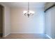 Dining room with tile floor and elegant chandelier, perfect for Gathering meals and gatherings at 635 Cottage Ln # 635, Lakeland, FL 33803