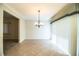 Dining room features neutral decor, tile floors, and sliding door for natural light at 635 Cottage Ln # 635, Lakeland, FL 33803