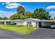 Well-maintained home featuring a convenient carport and pristine landscaping at 635 Cottage Ln # 635, Lakeland, FL 33803
