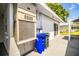Exterior featuring an HVAC unit, recycling bin, and a glimpse of the patio at 635 Cottage Ln # 635, Lakeland, FL 33803