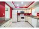 Kitchen featuring tile floors, granite countertops, and modern appliances at 635 Cottage Ln # 635, Lakeland, FL 33803