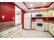 Spacious kitchen featuring tile floors, granite countertops, and modern appliances at 635 Cottage Ln # 635, Lakeland, FL 33803