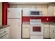 Kitchen featuring granite countertops, white cabinets, and stainless steel appliances at 635 Cottage Ln # 635, Lakeland, FL 33803